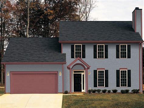 dark grey house with metal roof|gray house with dark trim.